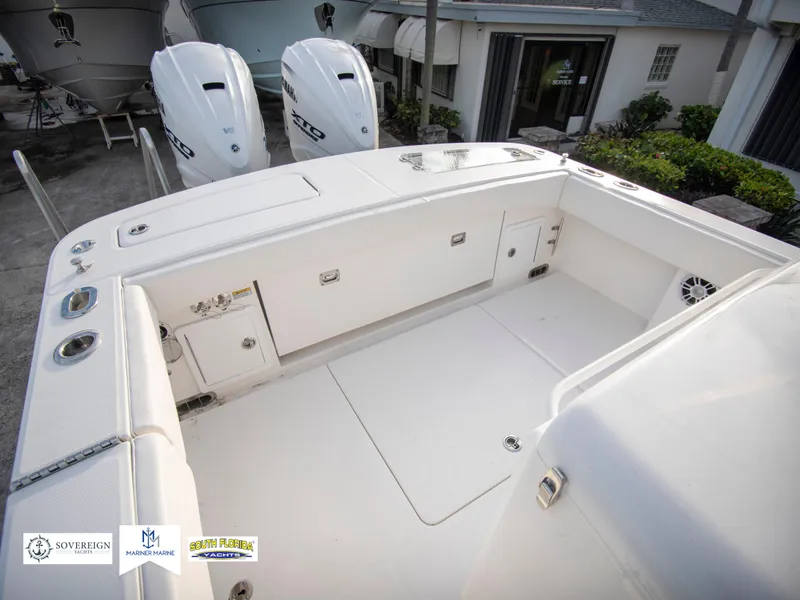 Slide: The Image of 2024 Regulator 31 boat deck with twin outboard engines. - 34