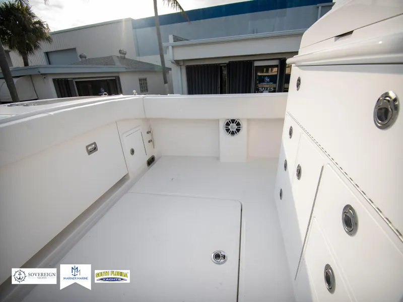 Slide: The Image of 2024 Regulator 31 boat deck with storage compartments and speaker. - 35