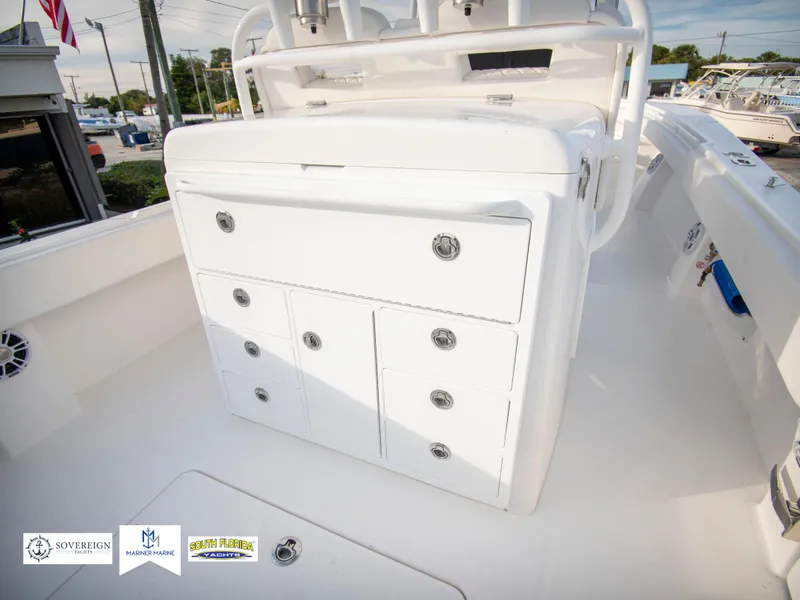 Slide: The Image of 2024 Regulator 31 boat storage compartments and seating area. - 41