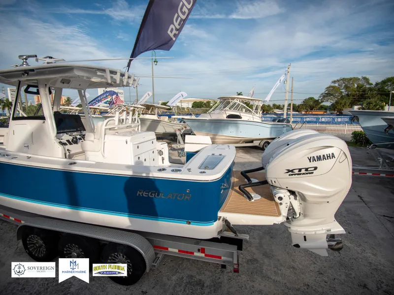 Slide: The Image of 2024 Regulator 31 boat with Yamaha XTO engine on display. - 5