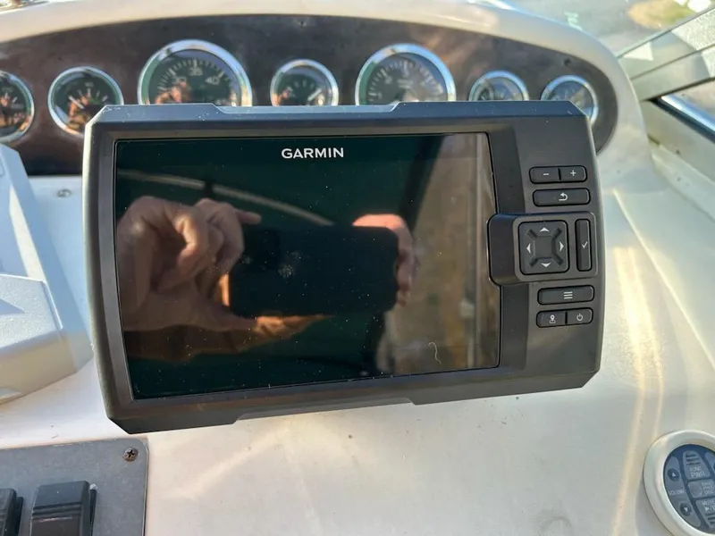 Slide: The Image of Garmin navigation system on 1997 Sea Ray Sundancer boat dashboard. - 13