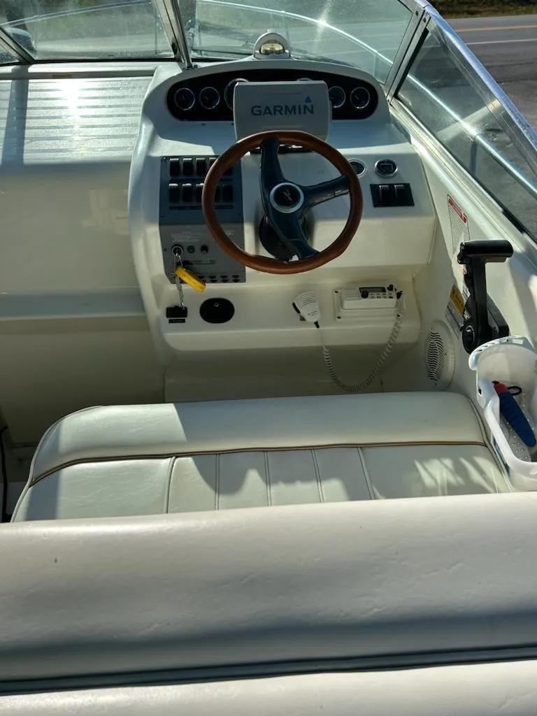 Slide: The Image of 1997 Sea Ray Sundancer boat helm with Garmin navigation system. - 9