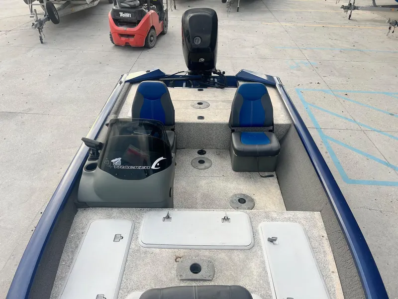 Slide: The Image of 2013 Tracker Pro Team 175 TF fishing boat with blue and gray seating. - 5