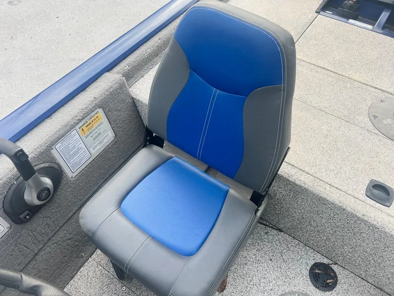 Slide: The Image of 2013 Tracker Pro Team 175 TF boat seat with blue and gray upholstery. - 6