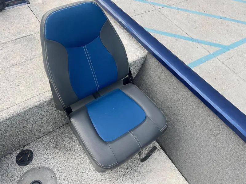 Slide: The Image of 2013 Tracker Pro Team 175 TF boat seat, blue and gray upholstery. - 7