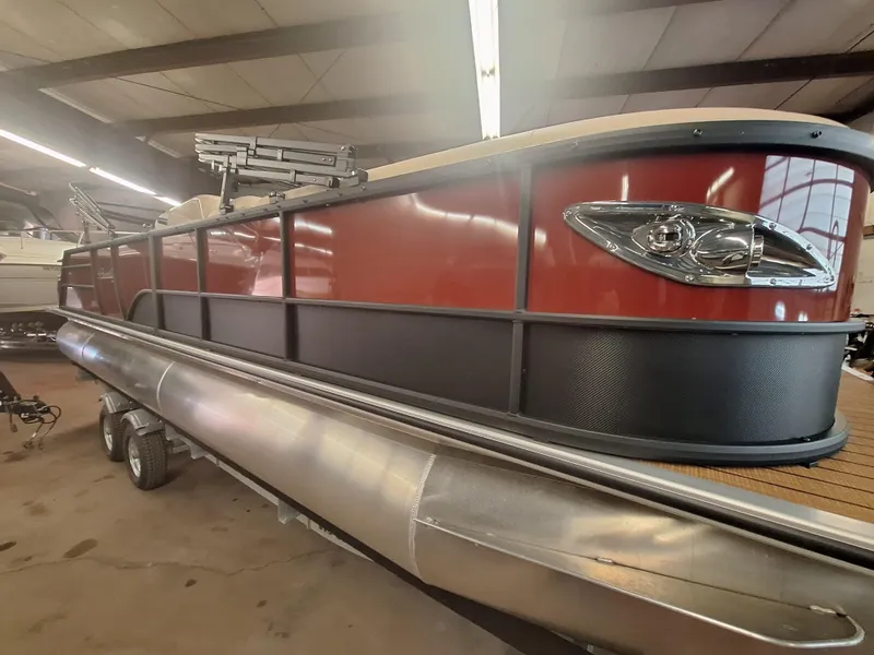 Slide: The Image of 2024 Bentley Pontoons Elite 253 SwingBack DC in showroom. - 2