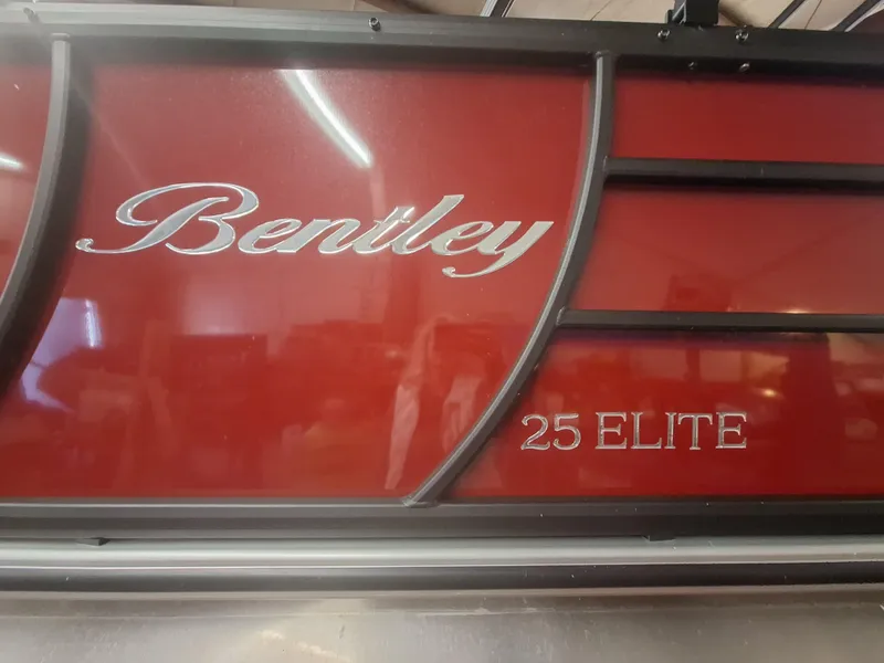 Slide: The Image of 2024 Bentley Pontoons Elite 253 SwingBack DC, red exterior with 25 Elite branding. - 4