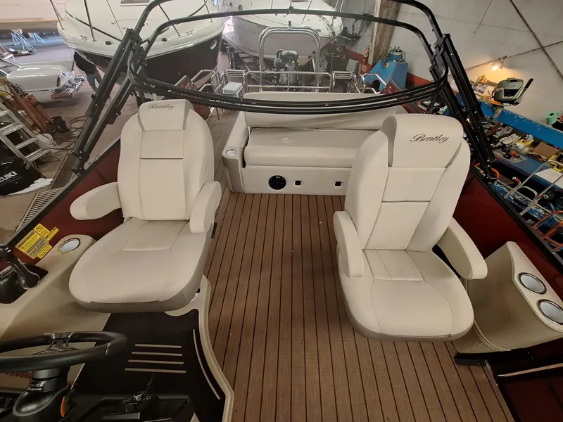 Slide: The Image of 2024 Bentley Pontoons Elite 253 SwingBack DC interior with luxurious seating. - 6