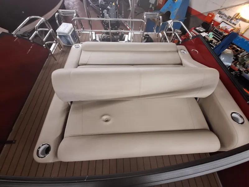 Slide: The Image of 2024 Bentley Pontoons Elite 253 SwingBack DC with luxurious beige seating. - 8