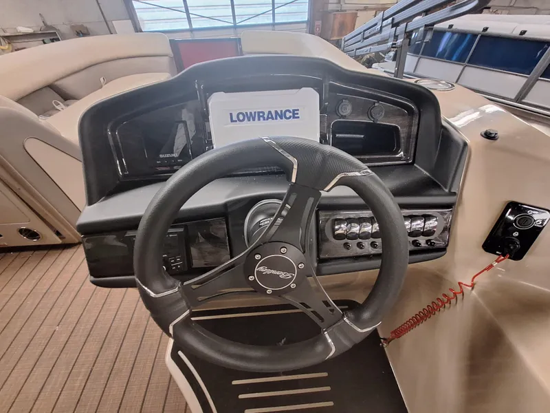 Slide: The Image of 2024 Bentley Pontoons Elite 253 SwingBack DC helm with Lowrance navigation system. - 9