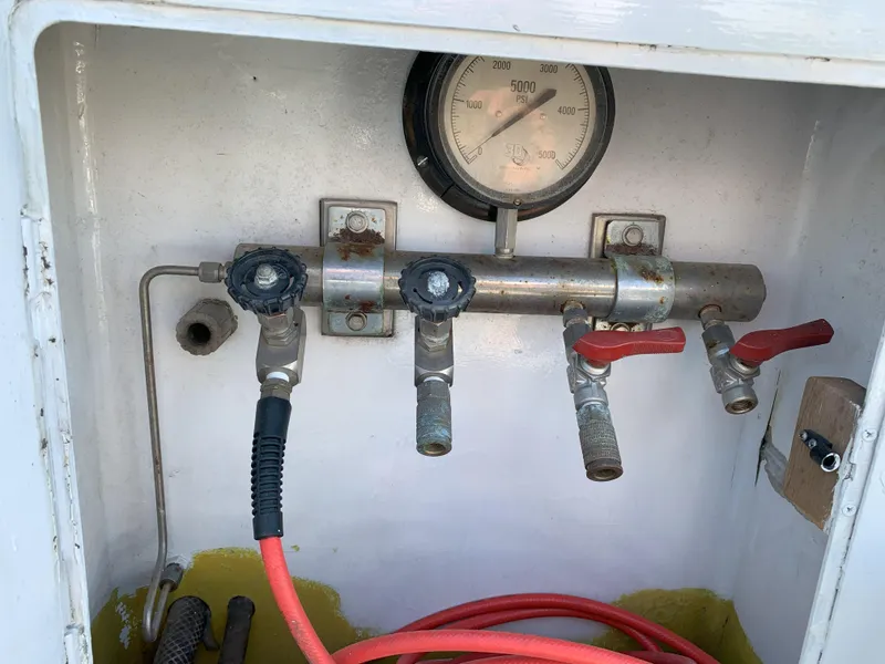 Slide: The Image of Control panel of a 1986 Gladding Hearn Hunt Designed 60 boat with pressure gauge and valves. - 20