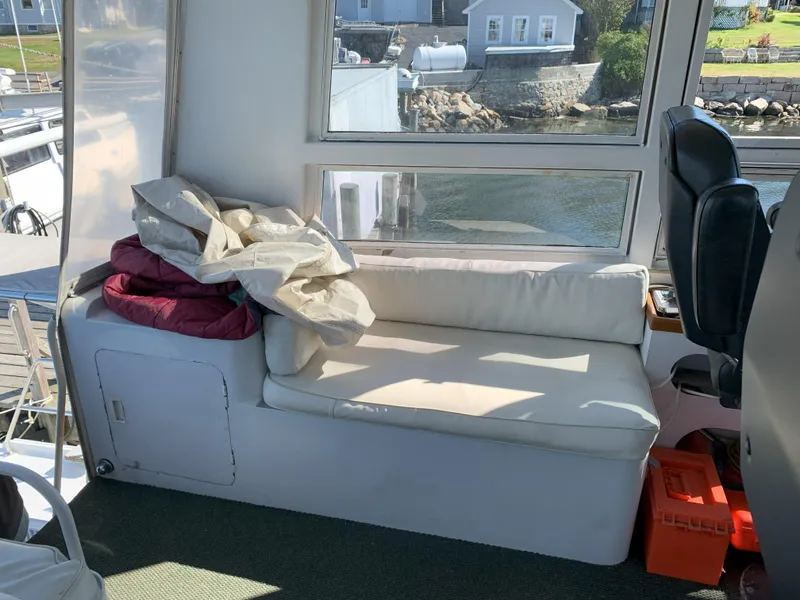 Slide: The Image of Interior of 1986 Gladding Hearn Hunt Designed 60 boat with white seating and window view. - 22