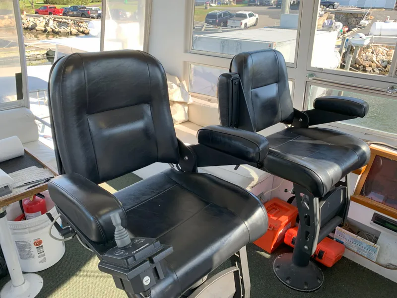 Slide: The Image of Captain's chairs on the 1986 Gladding Hearn Hunt Designed 60 boat. - 23