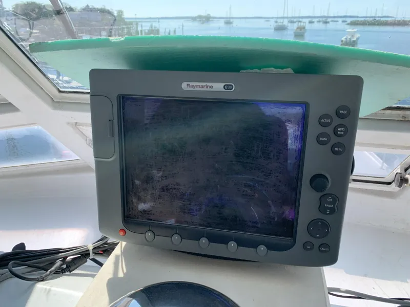 Slide: The Image of Raymarine display on 1986 Gladding Hearn Hunt Designed 60 boat with marina view. - 32