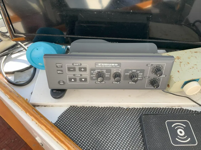 Slide: The Image of Furuno marine radio control panel on a 1986 Gladding Hearn Hunt Designed 60 boat. - 38