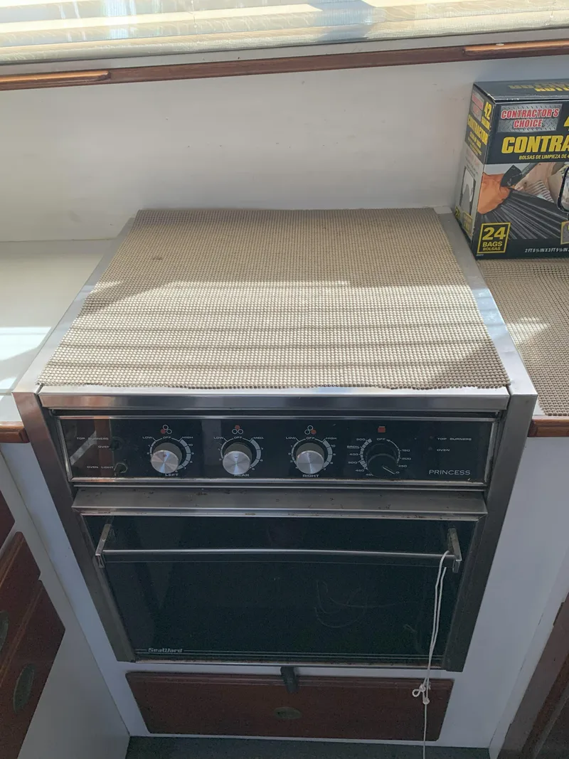 Slide: The Image of 1986 Gladding Hearn Hunt Designed 60 boat kitchen with stove and countertop. - 43