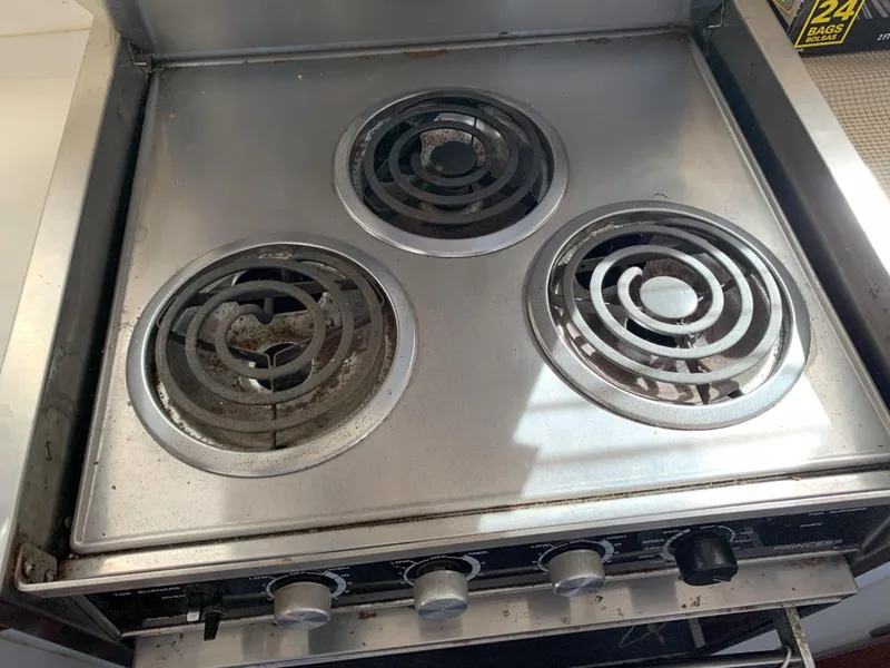 Slide: The Image of 1986 Gladding Hearn Hunt Designed 60 stove with three electric coil burners. - 44