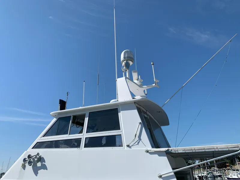 Slide: The Image of 1986 Gladding Hearn Hunt Designed 60 boat with radar and antennas against blue sky. - 5