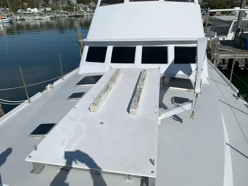 Slide: The Image of 1986 Gladding Hearn Hunt Designed 60 boat deck with windows, docked at marina. - 8
