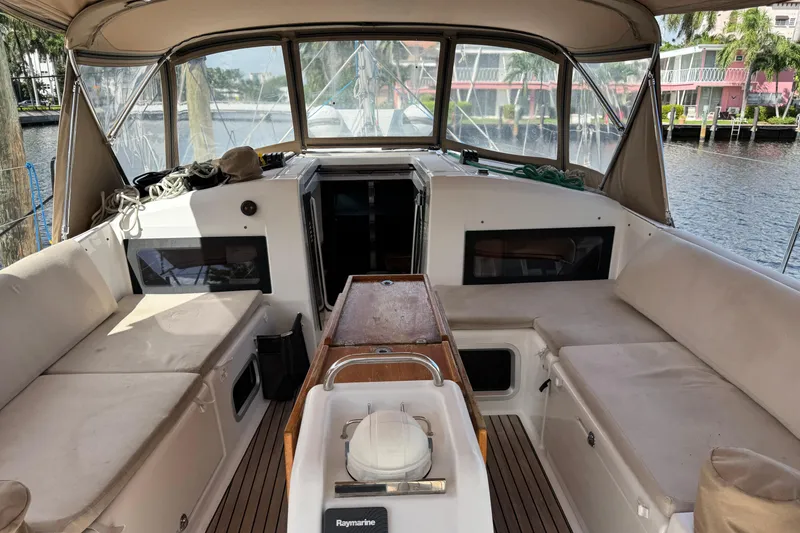 Slide: The Image of Interior view of 2018 Jeanneau Sun Odyssey 440 sailboat with seating and navigation equipment. - 10