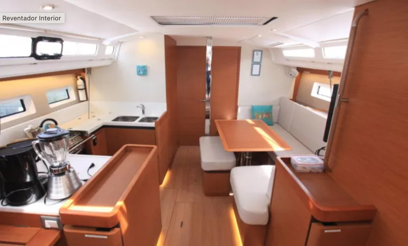 Slide: The Image of Interior of 2018 Jeanneau Sun Odyssey 440 yacht, featuring modern kitchen and dining area. - 15