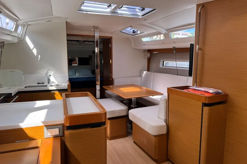 Slide: The Image of Interior of 2018 Jeanneau Sun Odyssey 440 yacht with modern kitchen and dining area. - 22