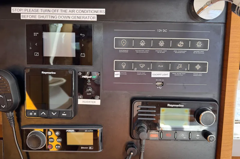 Slide: The Image of Control panel of a 2018 Jeanneau Sun Odyssey 440 sailboat with navigation and communication systems. - 23