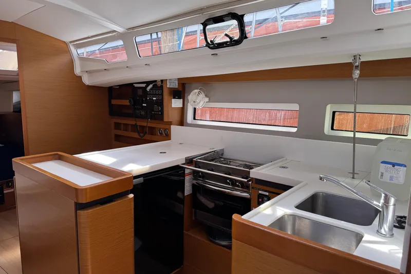 Slide: The Image of Interior of 2018 Jeanneau Sun Odyssey 440 yacht kitchen with modern amenities. - 26
