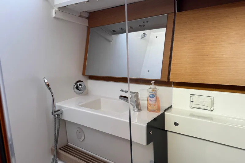 Slide: The Image of Modern bathroom in 2018 Jeanneau Sun Odyssey 440 yacht with sink and mirror. - 35