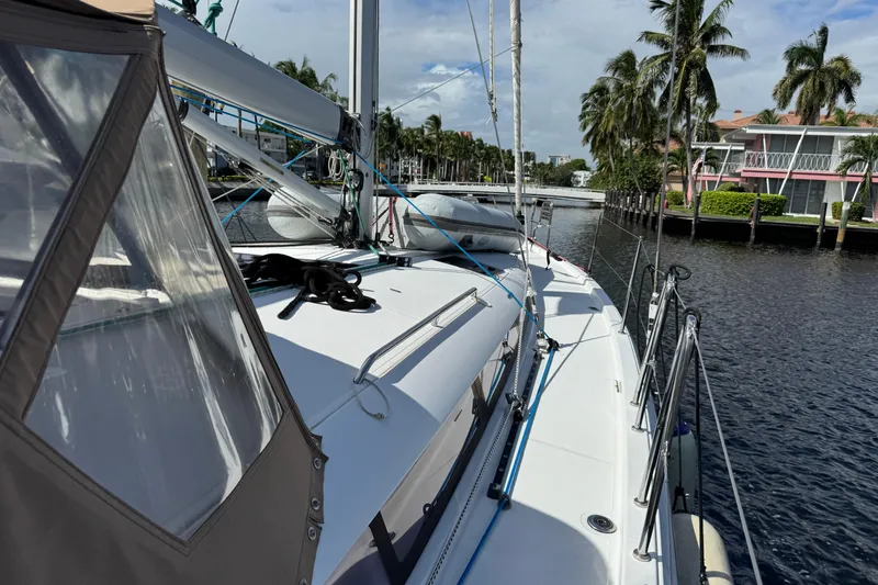 Slide: The Image of Jeanneau Sun Odyssey 440 sailboat docked by palm trees, 2018 model. - 7