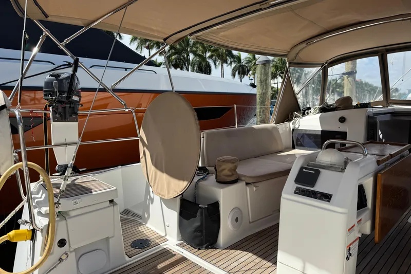 Slide: The Image of Jeanneau Sun Odyssey 440 sailboat interior, 2018 model, featuring spacious cockpit and seating area. - 9