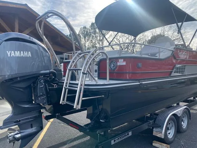 Slide: The Image of 2024 SunCatcher Elite 324 SS pontoon boat with Yamaha outboard motor on trailer. - 10