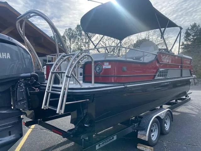 Slide: The Image of 2024 SunCatcher Elite 324 SS pontoon boat on a trailer with Yamaha engine. - 11