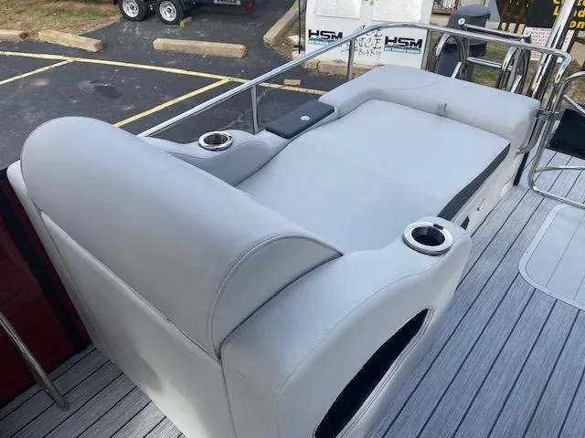 Slide: The Image of 2024 SunCatcher Elite 324 SS boat with luxurious seating and cup holders. - 14