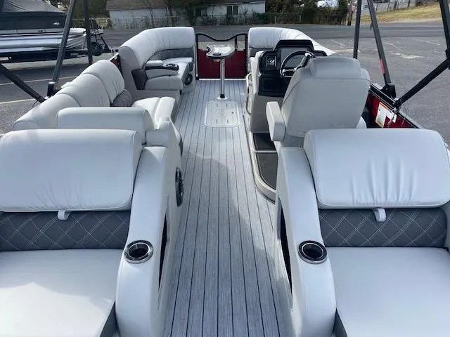 Slide: The Image of 2024 SunCatcher Elite 324 SS pontoon boat interior with luxurious seating and modern design. - 18