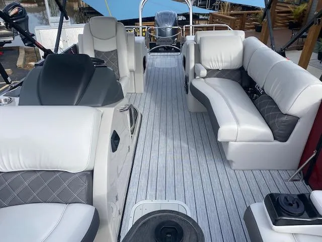 Slide: The Image of 2024 SunCatcher Elite 324 SS pontoon boat interior with luxurious seating and modern design. - 20
