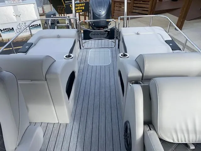 Slide: The Image of 2024 SunCatcher Elite 324 SS pontoon boat interior with luxurious seating and modern design. - 23