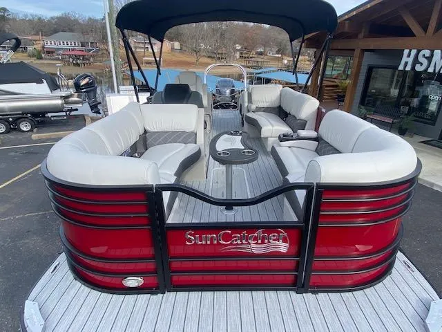 Slide: The Image of 2024 SunCatcher Elite 324 SS pontoon boat with spacious seating and sleek design. - 5