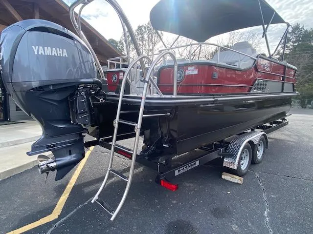 Slide: The Image of 2024 SunCatcher Elite 324 SS pontoon boat with Yamaha outboard motor on trailer. - 8