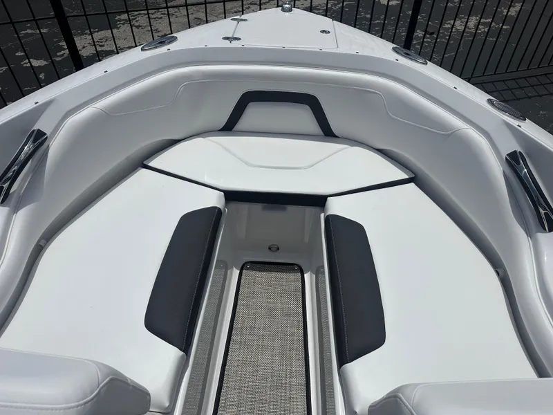 Slide: The Image of 2024 Monterey 224 FS boat interior with sleek white seating and black accents. - 10