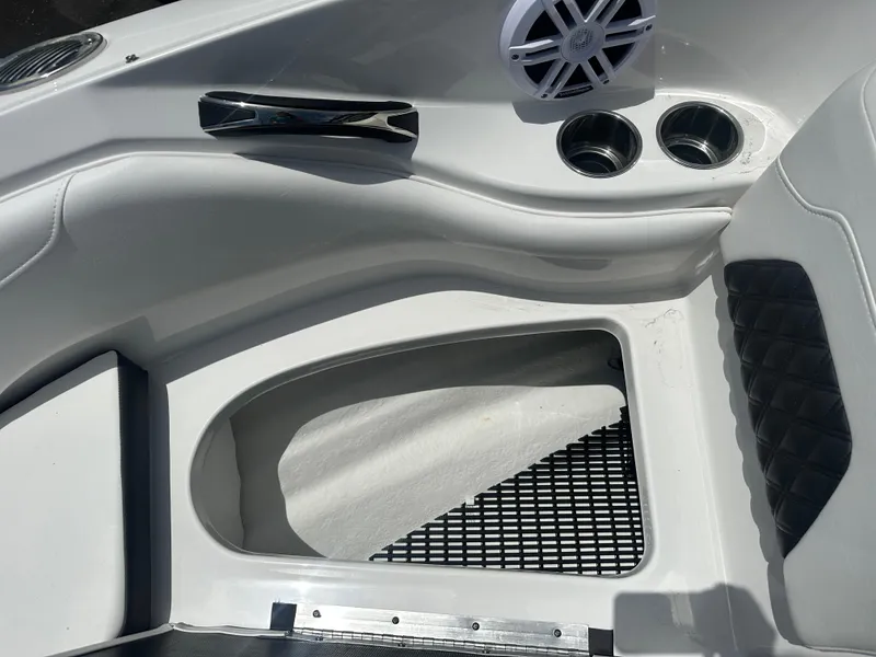 Slide: The Image of 2024 Monterey 224 FS boat interior with speaker and cup holders. - 17