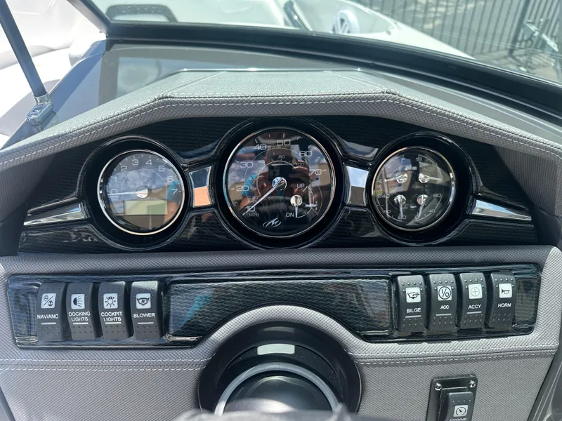 Slide: The Image of 2024 Monterey 224 FS dashboard with gauges and control switches. - 24