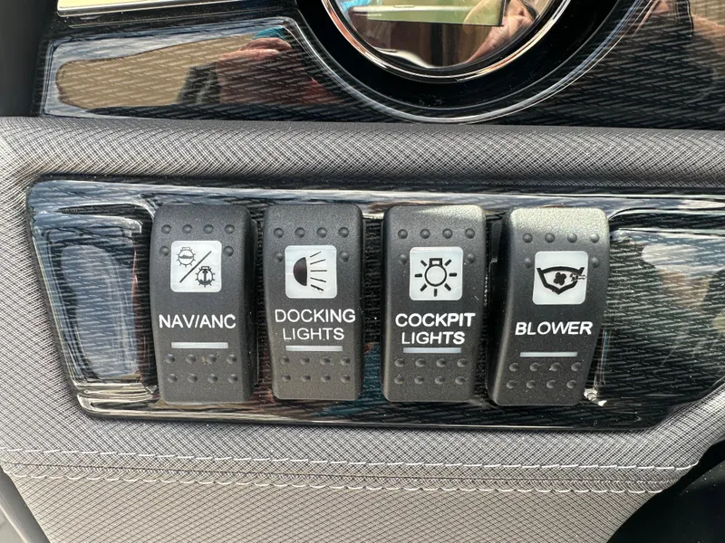 Slide: The Image of Control panel of 2024 Monterey 224 FS boat with labeled switches for lights and blower. - 27