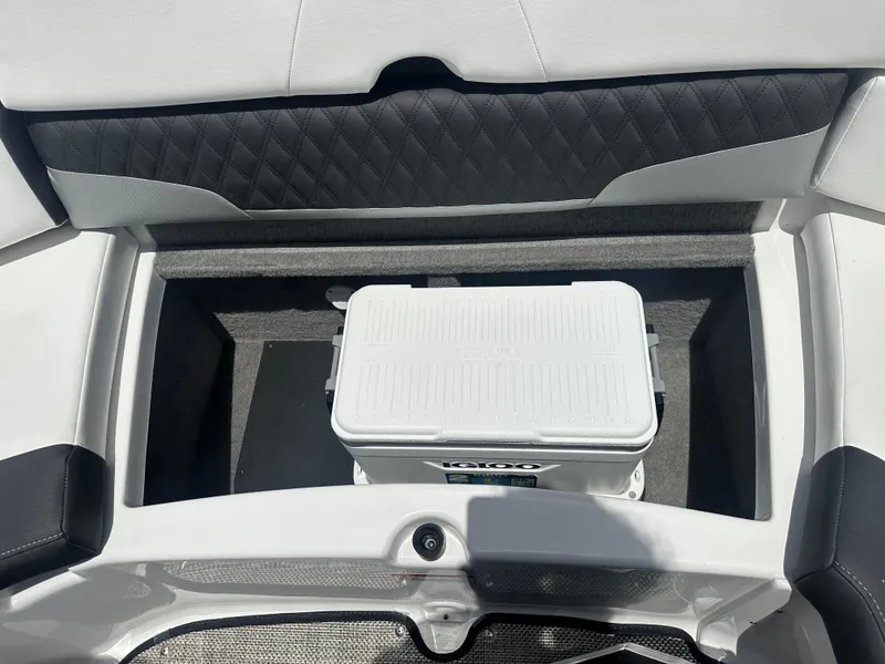 Slide: The Image of 2024 Monterey 224 FS boat storage compartment with cooler. - 35