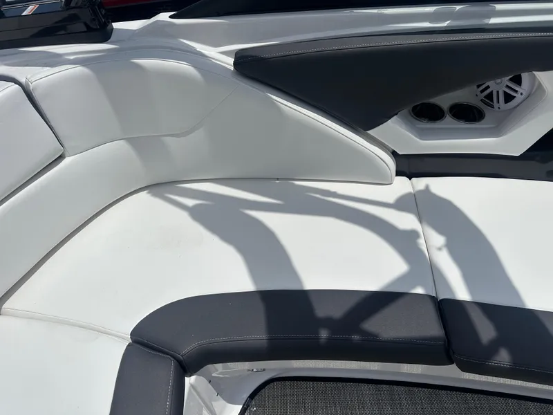 Slide: The Image of 2024 Monterey 224 FS boat interior with white and black seating. - 36