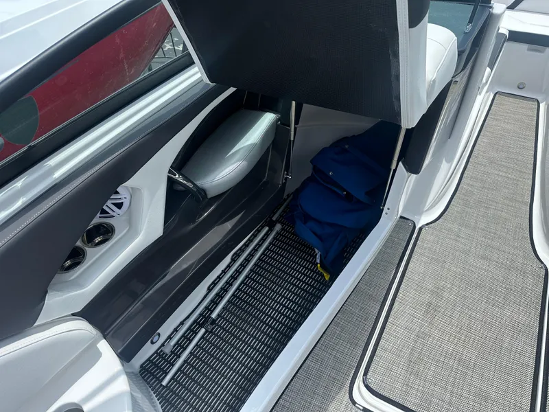 Slide: The Image of 2024 Monterey 224 FS boat interior with storage compartment and seating. - 39