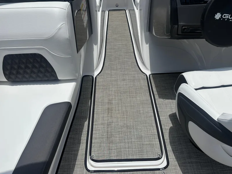 Slide: The Image of 2024 Monterey 224 FS boat interior with sleek seating and textured flooring. - 43