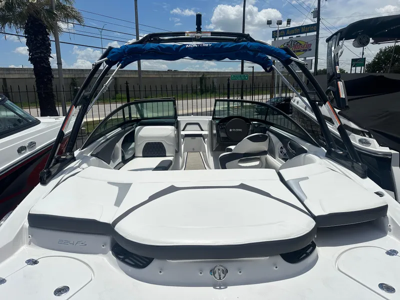 Slide: The Image of 2024 Monterey 224 FS boat with sleek white interior and modern design. - 8