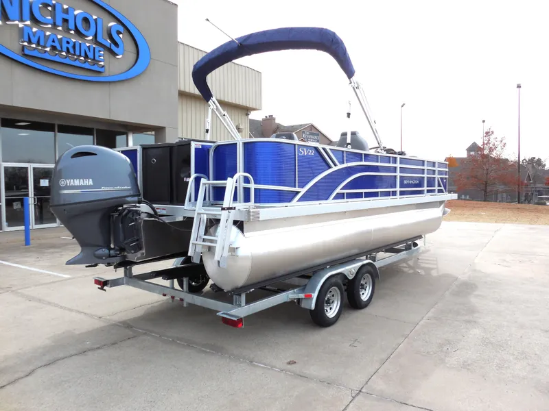 Slide: The Image of 2024 Bennington 22 SVF pontoon boat on trailer at Nichols Marine dealership. - 3
