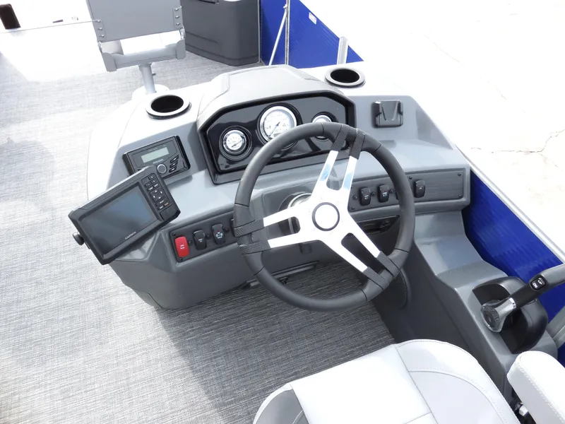 Slide: The Image of 2024 Bennington 22 SVF boat dashboard with steering wheel and navigation system. - 6